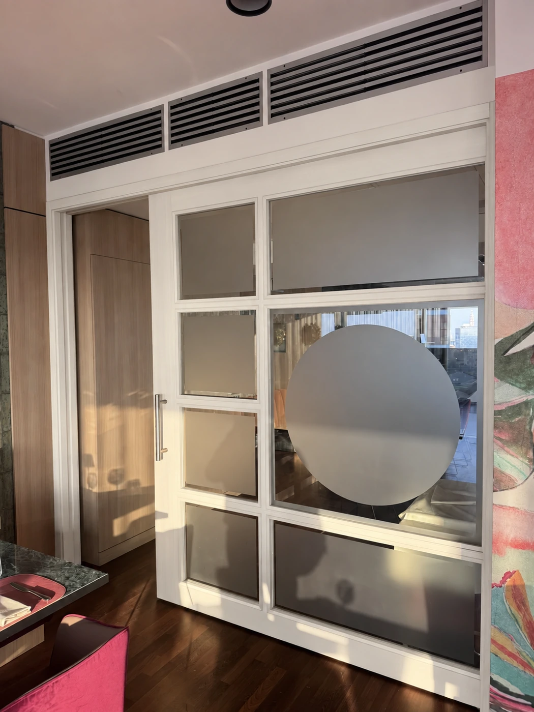 Reconstruction of the before: white door and frame, wooden wardrobe in the background
